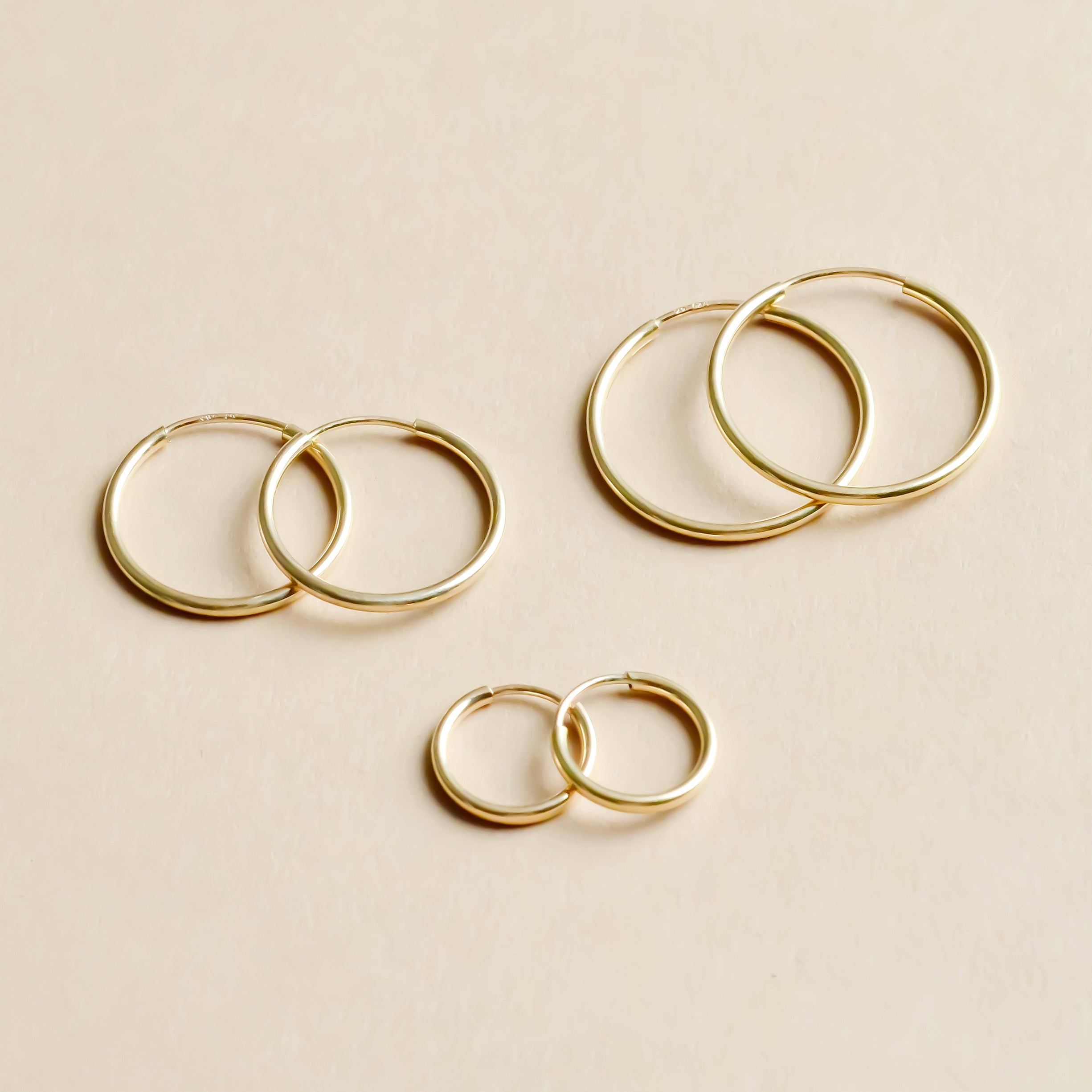 Small gold endless 2025 hoop earrings